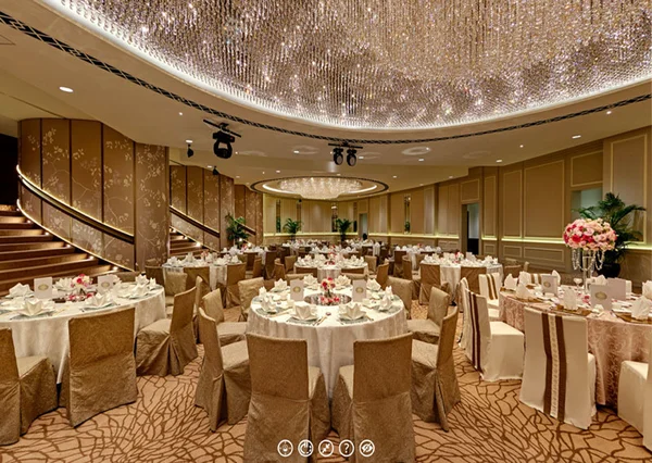 Hotel virtual tour of Fullerton Hotel Singapore Tempo bar with copper counter, bartender, and illuminated bottle shelves